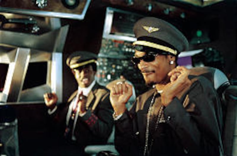 Captain Mack (Snoop Dogg), Gaeman (Godfrey) fly low in "Soul Plane."