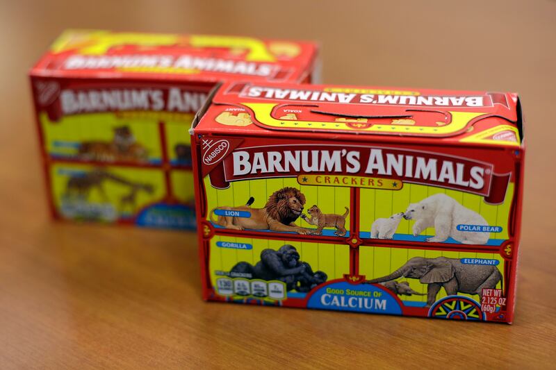 This photo shows Nabisco Barnum's Animals crackers on the shelf of a grocery store in Des Moines, Iowa. After more than a century behind bars, the beasts on boxes of animal crackers are roaming free. The new boxes retain their familiar red and yellow colo