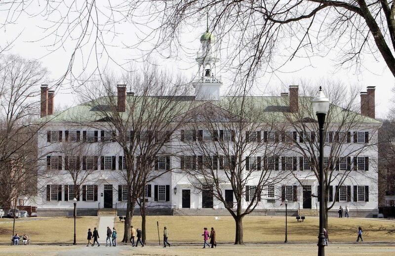 In this photo taken Monday March 12, 2012, students walk across the Dartmouth College campus green in Hanover, N.H. More than a quarter of the Sigma Alpha Epsilon fraternity's membership has been accused by the school's judicial council of hazing after a