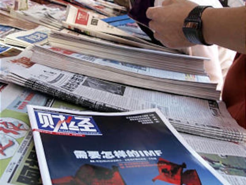 An issue of the Caijing Magazine is seen at a newsstand in Beijing. Hu Shuli, the founder and editor-in-chief of the Chinese magazine known for pushing boundaries with the country's censors and chasing stories that could embarrass the government, resigned