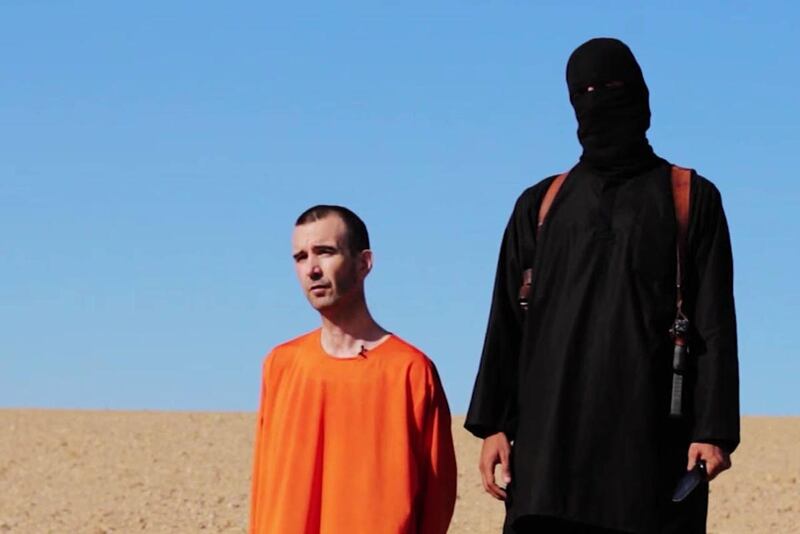 This image made from a video posted on the Internet by Islamic State militants and provided by the SITE Intelligence Group, a U.S. terrorism watchdog, on Saturday, Sept. 13, 2014, purports to show British aid worker David Haines before he was beheaded. Th