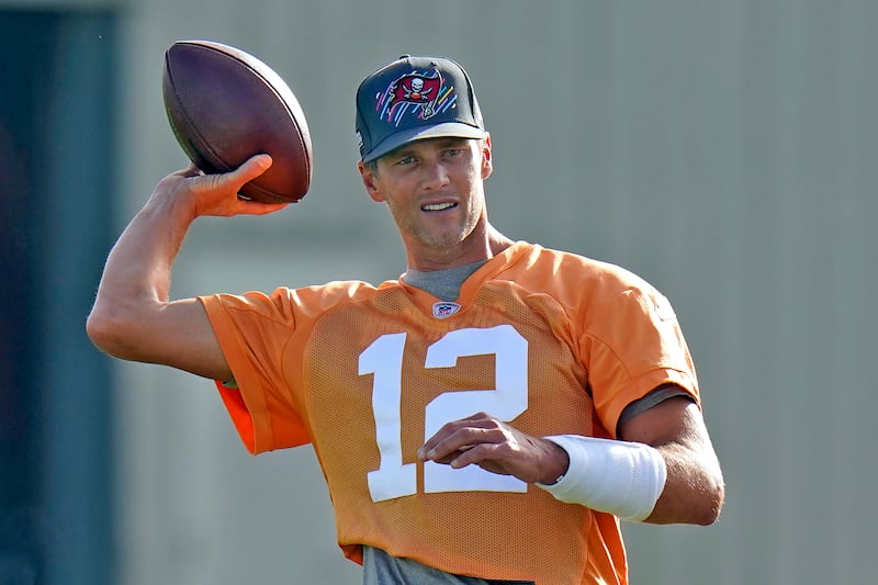 Tampa Bay Buccaneers quarterback Tom Brady throws a pass during a team practice on July 28, 2022.