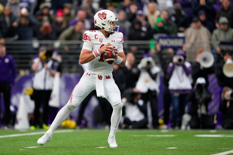 Utah quarterback Bryson Barnes looks to pass