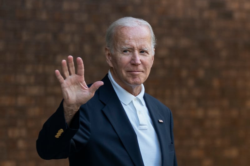 President Joe Biden waves in front of a brick building in Johns Island, S.C. on Aug. 13, 2022.