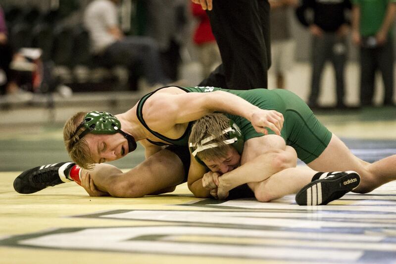 Utah Valley 125-pound redshirt freshman (top) looks to gain control over teammate Josh Jensen during the UVU Green and Black Intrasquad Dual on Oct. 27. On Friday, he went a perfect 3-0 for the Wolverines with two wins over nationally-ranked opponents.