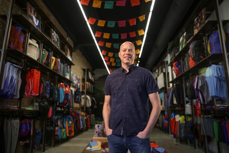 Davis Smith, co-founder and CEO of Cotopaxi, poses for a photo at Cotopaxi’s headquarters in Salt Lake City.