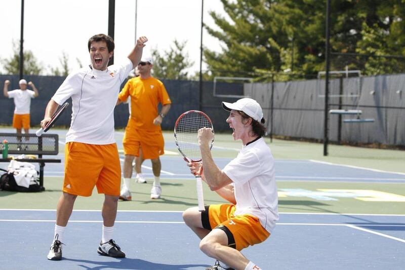 In this April 10, 2011, photo provided by UT Sports Information, University of Tennessee senior tennis player John-Patrick Smith, right, and his teammate, Boris Conkic, left, react during a doubles match against Florida's Alexandre Lacroix and Sekou Bango