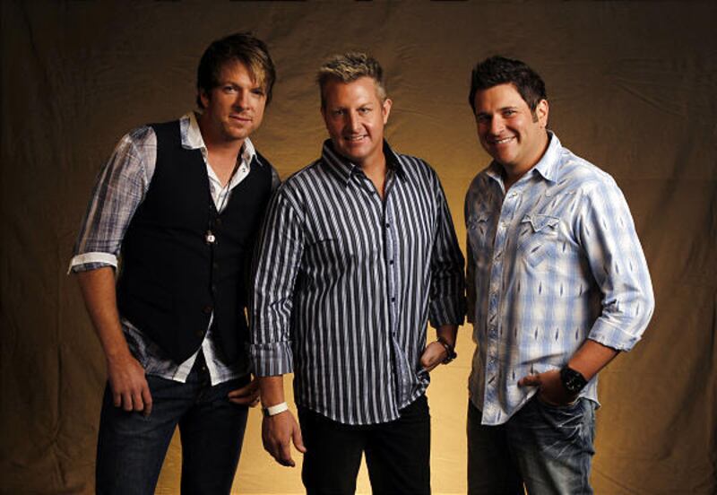 Rascal Flatts' Joe Don Rooney, left, Gary Levox and Jay DeMarcus would like an invitation to Grand Old Opry.