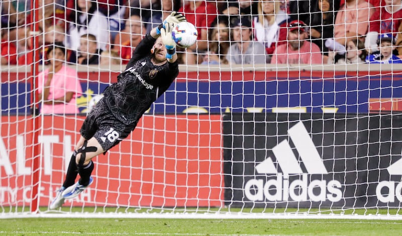 Zac MacMath (18) of Real Salt Lake jumps to make a save against Vancouver Whitecaps FC at Rio Tinto Stadium in Sandy on Saturday, Aug. 20, 2022. The game was a 1-1 draw.