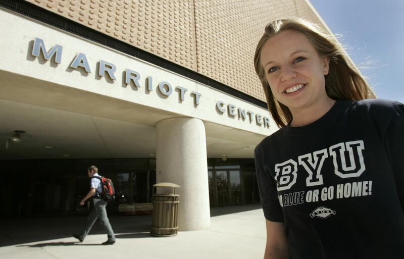 A BYU student outside of the Marriott Center on campus in Provo, Utah