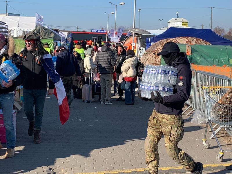 Ukrainian refugees arriving in Poland are offered food and supplies.