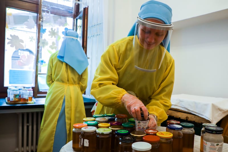 Nuns distribute food to the poor and homeless during the COVID-19 pandemic