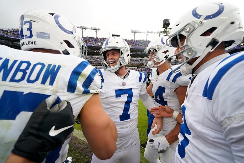 Indianapolis Colts place kicker Matt Gay (7) celebrates with teammates after kicking game-winning field goal during overtime.