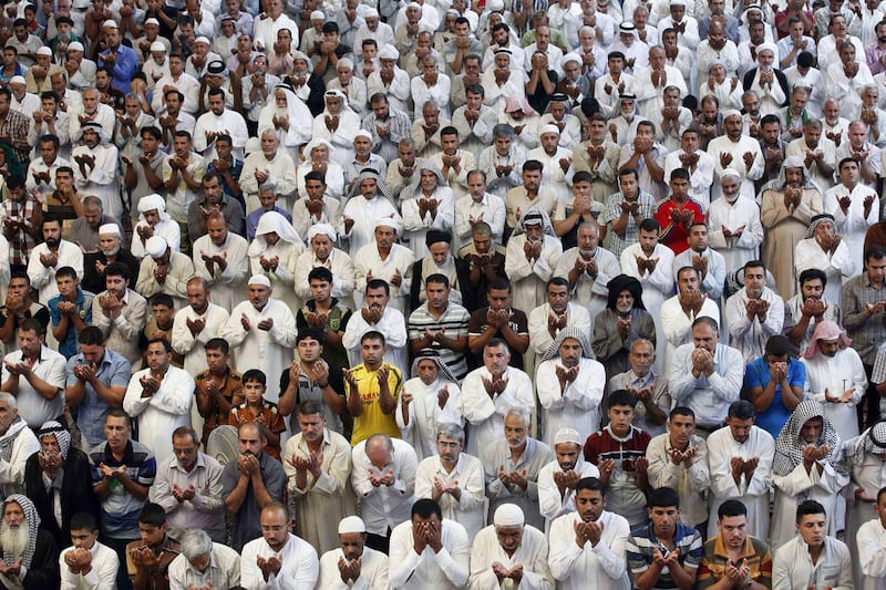 Shiite Muslim worshippers pray at the holy shrine of Imam Abbas during the annual festival of Shabaniyah, which marks the anniversary of the birth of the ninth-century Shiite leader known as the Hidden Imam, in Karbala, 50 miles (80 kilometers) south of B