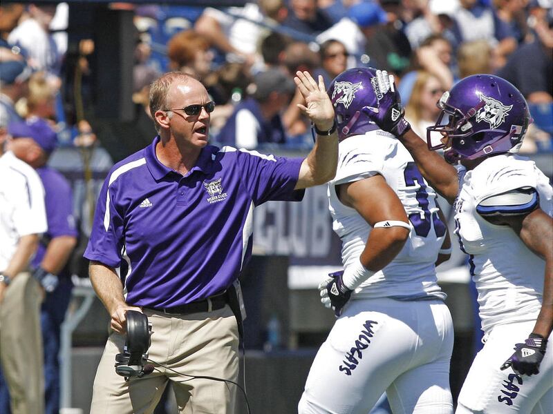 Weber State coach Jody Sears encourages his players during the first half as Brigham Young University plays Weber State University in football Saturday, Sept. 8, 2012, in Provo, Utah.