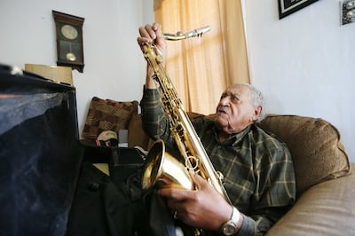 Saxophone player Joe McQueen, still going strong as he nears his 99th birthday, Joe assembles his horn at his Ogden home on Saturday, May 26, 2018.