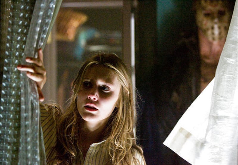 Julianna Guill and Derek Mears, background, star in the film "Friday the 13th."