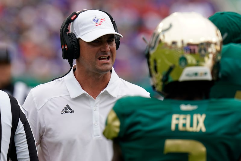 South Florida head coach Jeff Scott talks to a player during game against Florida Saturday, Sept. 11, 2021, in Tampa, Fla.
