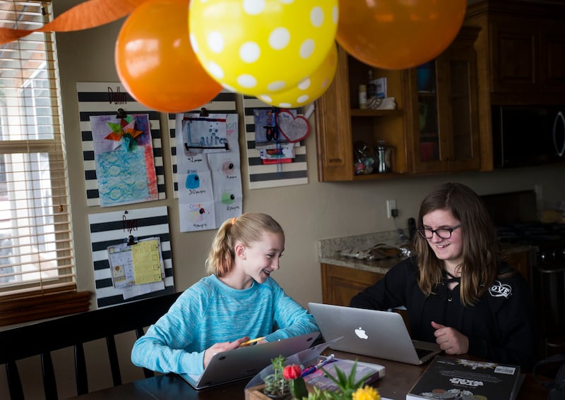 Lauren Greenwell and Emery Nelson color after school at the Greenwell's home in Park City on Friday, March 16, 2018.
