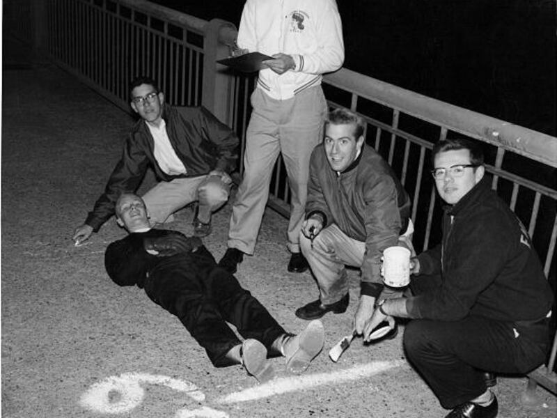 Fraternity brothers used MIT student Oliver Smoot, lying on the ground, to measure the Massachusetts Avenue Bridge in 1958.