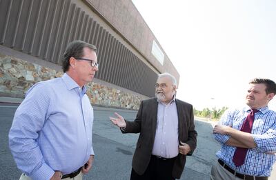 Clark Ivory, left, Jeff Woodbury and Mack Woodbury stand at the site of the former Cottonwood Mall in Holladay on Thursday, Sept. 6, 2018.