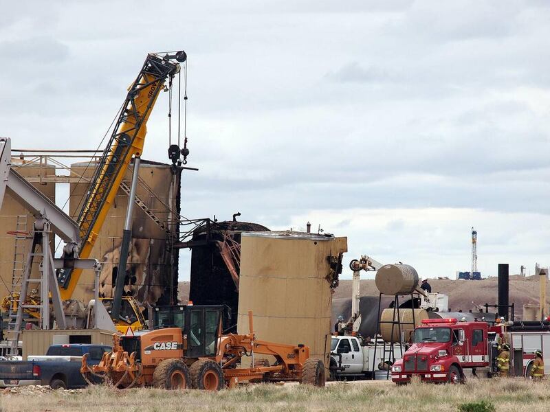 Crews work Wednesday, May 8, 2013, to recover the body of a man killed Tuesday, May 7, 2013, when a storage tank at an oil well exploded in Uintah County. One other person was injured in the blast at the well site, which is owned by Newfield Production.