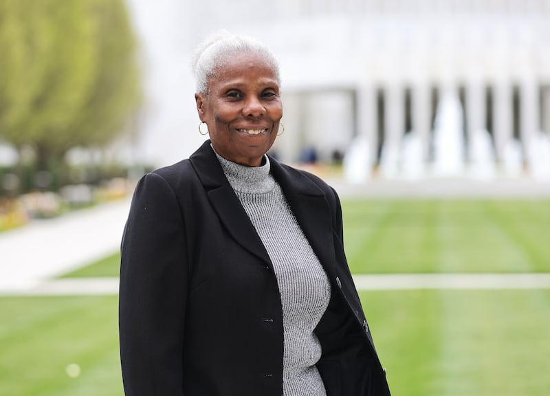 Washington, D.C., resident Dorothy Galloway poses in front of the Washington D.C. Temple in Kensington, Maryland.