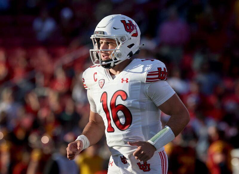 Utah quarterback Bryson Barnes jogs off field during game vs. the USC Trojans at Los Angeles Memorial Coliseum on Saturday