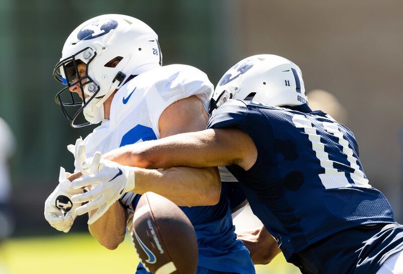 Vanderbilt grad transfer Gabe Jeudy-Lally, right, wraps up during fall practices in Provo.