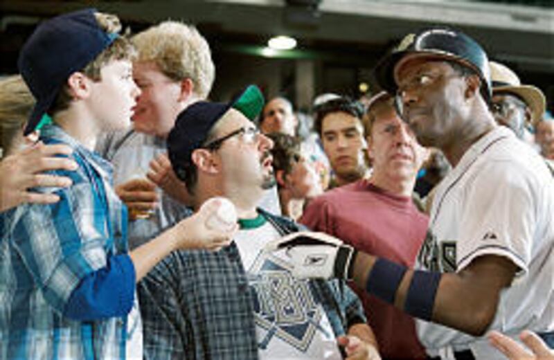 Milwaukee superstar Stan Ross (Bernie Mac) confronts a young fan who's caught a hit in the predictable and not very funny "Mr. 3000."