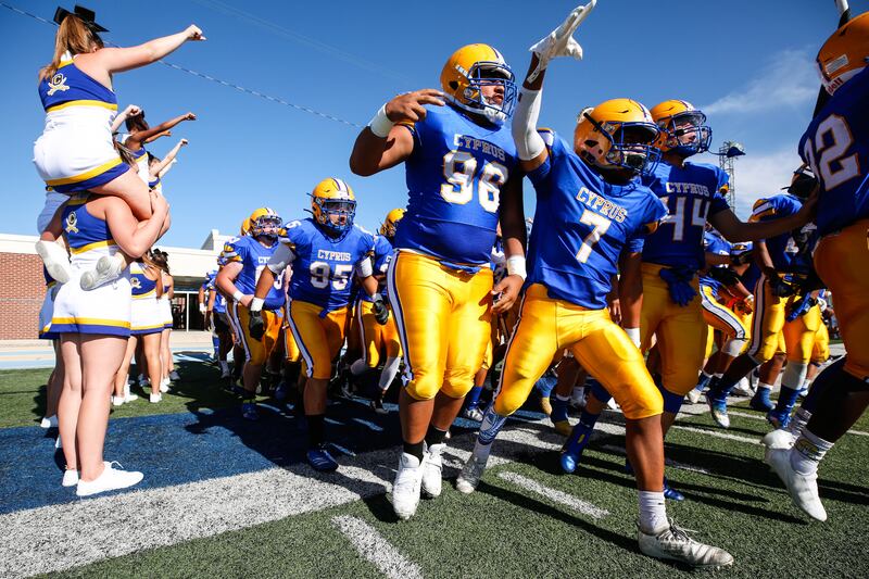 Cyprus players take the field before a high school football game against Snow Canyon.