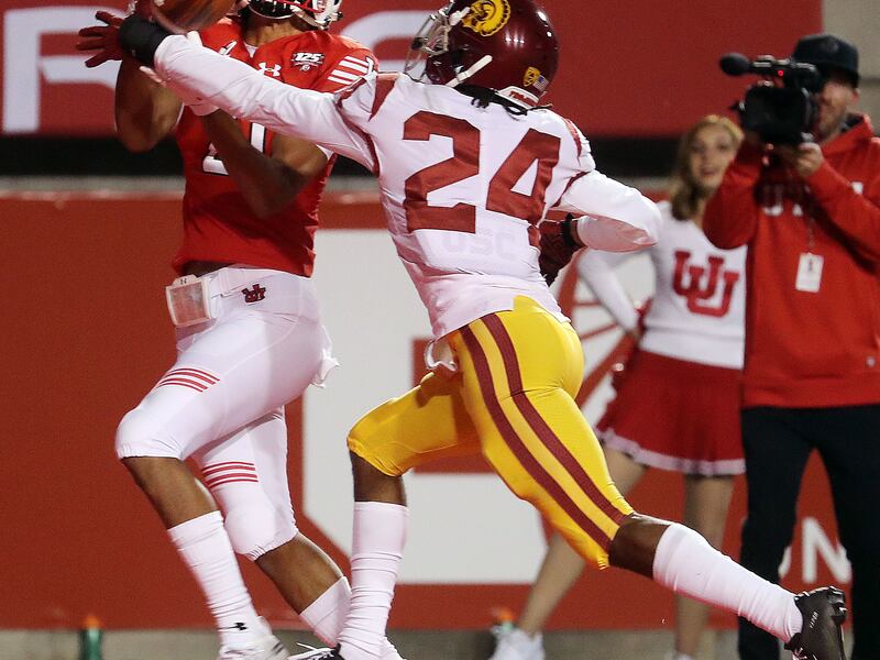 Utah wide receiver Solomon Enis catches a touchdown pass over USC cornerback Isaiah Langley in Salt Lake City on Saturday, Oct. 20, 2018.