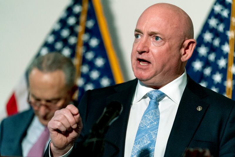 Sen. Mark Kelly, D-Ariz., speaks at a news conference following a luncheon on Capitol Hill in Washington on Feb. 8, 2022.
