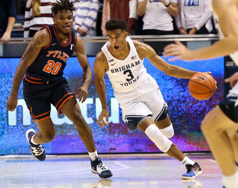 BYU guard Blaze Nield (3) runs the ball down the court against UT-Tyler guard Darius Alford (20) during an exhibition game.