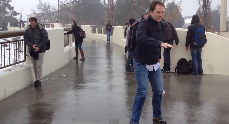 BYU students sliding down the skybridge across Campus Drive, Thursday, January 24, 2013.