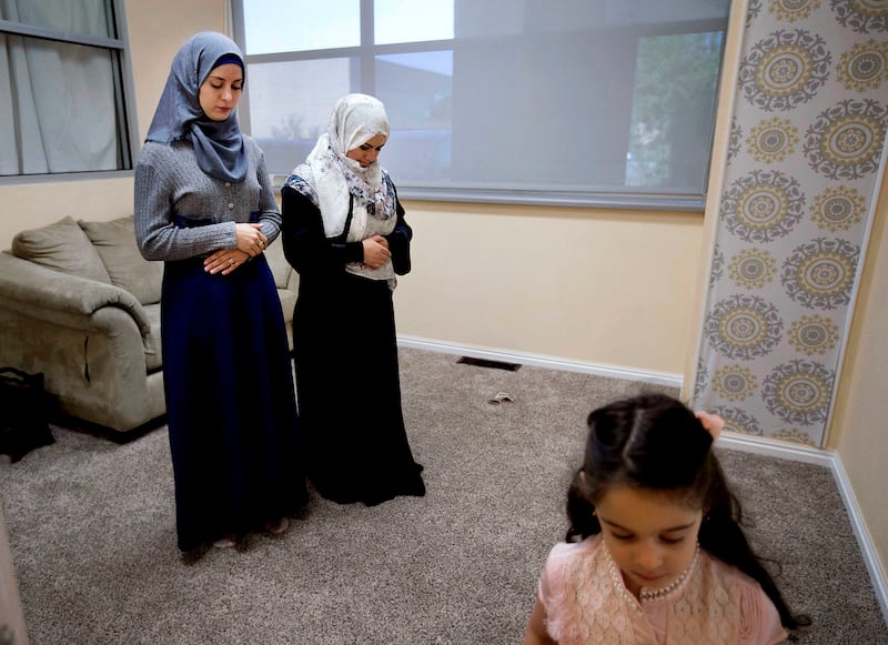 Baraa Hamad prays during Eid al-Adha at the Muslim Community Center in Cottonwood Heights on Sept. 1. Her husband and three sons pray with the other men in a room facing the imam. “The ultimate reason of this feast is the concept of sacrifice,” Imam Sheik