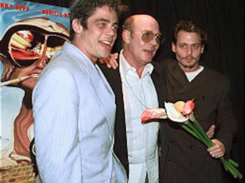 Benicio Del Toro, left, and Johnny Depp, right, join Hunter S. Thompson, center, author of the classic pop culture novel "Fear and Loathing in Las Vegas," at the premier of the film adaptation of Thompson's book.