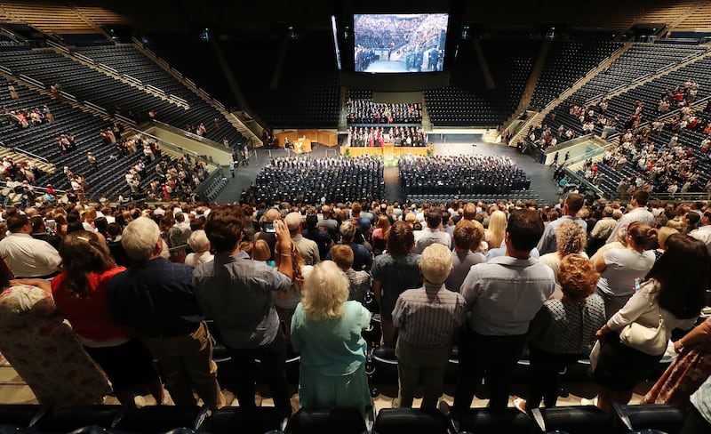 Attendees watch Brigham Young University summer commencement in Provo on Thursday, Aug. 16, 2018.