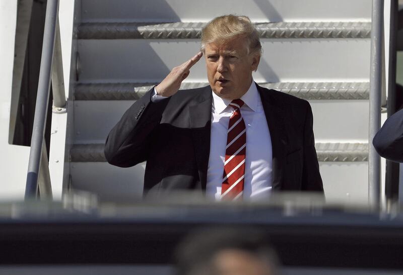 FILE — In this Monday, Feb. 6, 2017, photo, U.S. President Donald Trump salutes as he arrives on Air Force One at MacDill Air Force Base, in Tampa, Fla. New Zealand's Prime Minister Bill English said Tuesday he told Trump during a phone call that he disag