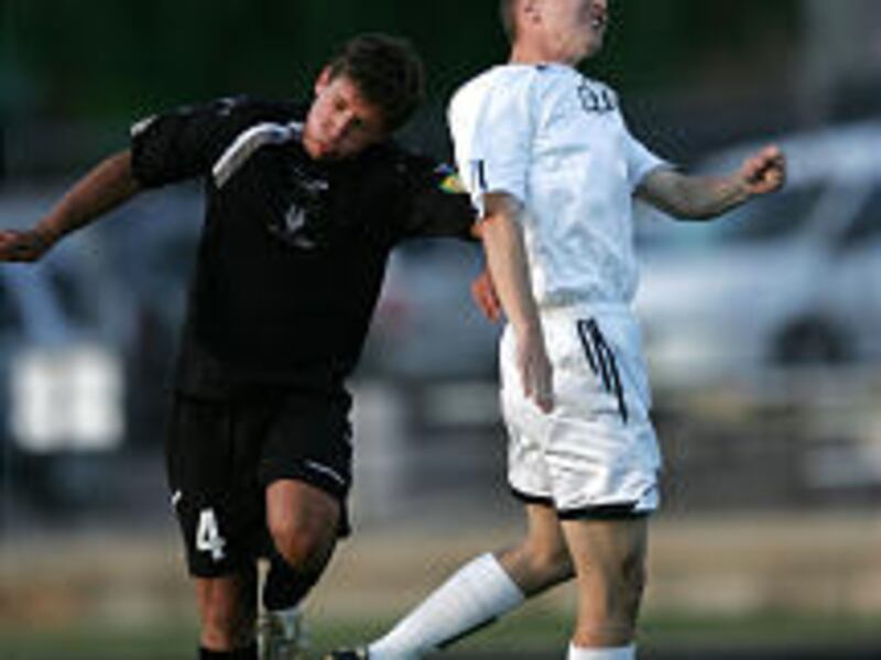 Ogden's Russell McCluskey (4) loses his chance for a header to BYU's Zachary De Francis during the Outlaws' 1-1 tie on Friday.