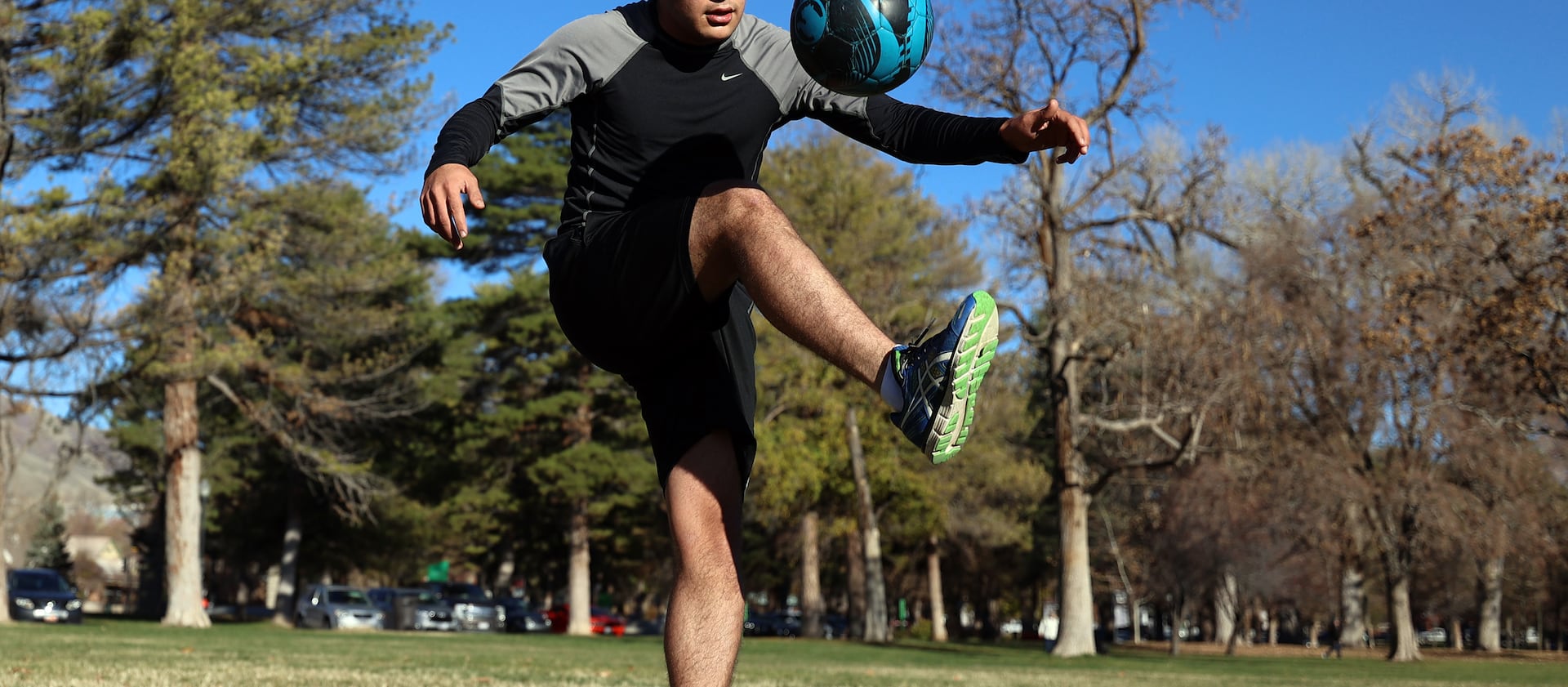 Afghan refugee Mohammad Tamim Solhadost goes through a workout at Liberty Park in Salt Lake City.