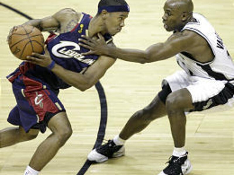 San Antonio backup point guard Jacque Vaughn defends Cleveland's Daniel Gibson in the NBA Finals.