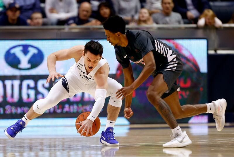 BYU guard Alex Barcello steals a loose ball from Santa Clara’s Tahj Eaddy on Feb. 20, 2020. Barcello will return next season.