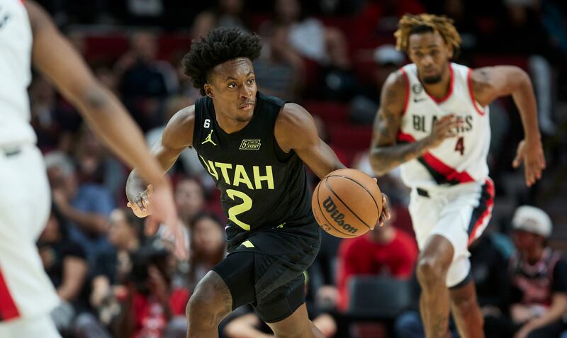 Utah Jazz guard Collin Sexton, wearing black brings the ball up against the Portland Trail Blazers during the second half of an NBA basketball game in Portland, Ore., Tuesday, Oct. 4, 2022.