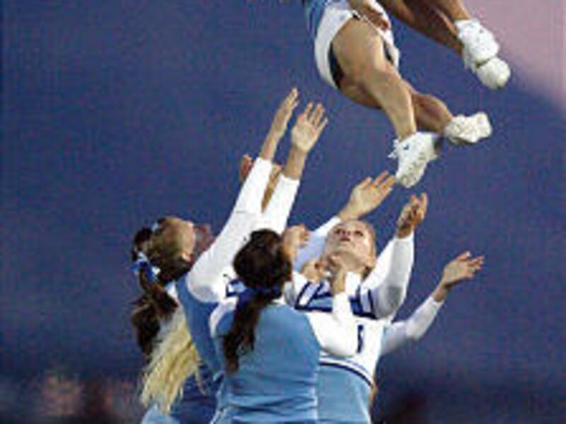 Sky View High School cheerleaders perform at halftime during game against Logan on Sept. 5 in Smithfield. There is very little regulation and no enforcement in cheerleading.