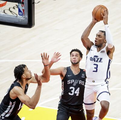 Utah Jazz guard Trent Forrest shoots over San Antonio’s Skal Labissiere and Anthony Mathis during Summer League game at Vivint Arena in Salt Lake City on Tuesday, Aug. 3, 2021.