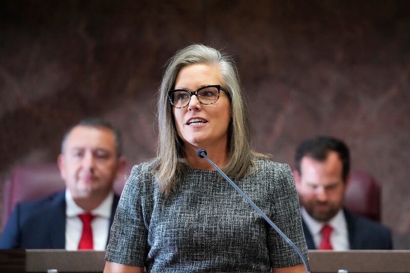 Democratic Arizona Gov. Katie Hobbs, center, delivers her state of the state address at the Arizona Capitol in Phoenix on Jan. 9, 2023.