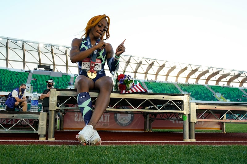 Sha’Carri Richardson celebrates after winning the women’s 100-meter dash at the Olympic trials.
