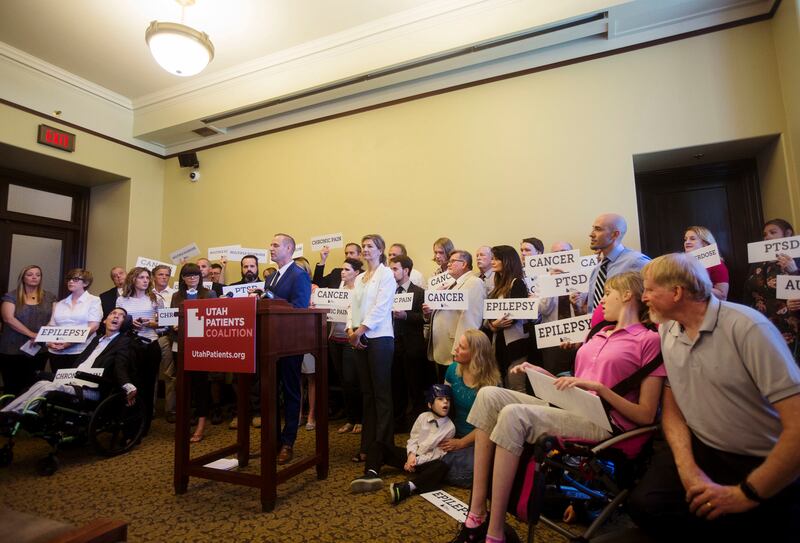 Supporters, patients and legislators stand in solidarity with signs that read of illnesses and disorders that could potentially be treated with medical cannabis during a press conference held by the Utah Patients Coalition to promote the 2018 medical cann