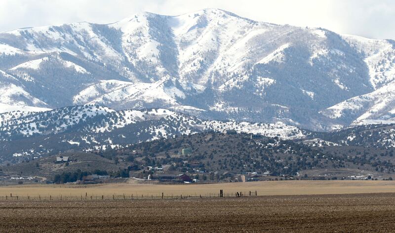 FILE - Land between 6300 West and 8500 West and 12400 South and 13100 South in unincorporated Salt Lake County, foreground, that is proposed for the Olympia Hills development on Monday, March 11, 2019.